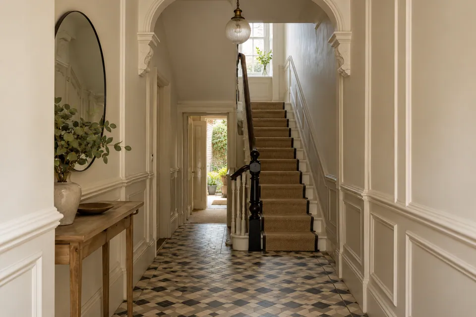 Entrance staircase with tiled hallway